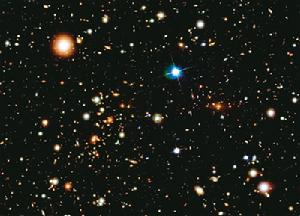 星系團1E 0657-56（被稱為子彈狀星系團）位於38億光年之外，好像是神秘的宇宙暗流所推動的幾百個星系團之一
